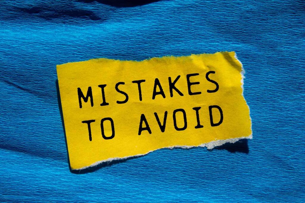 words mistakes to avoid in torn yellow paper on a blue background