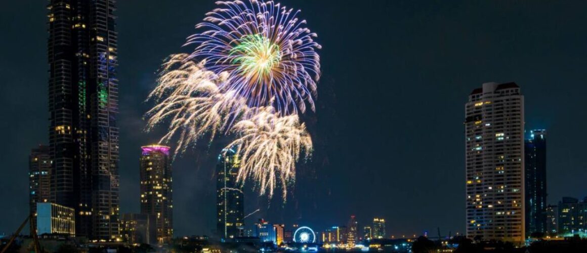 fireworks on the river in the dark sky
