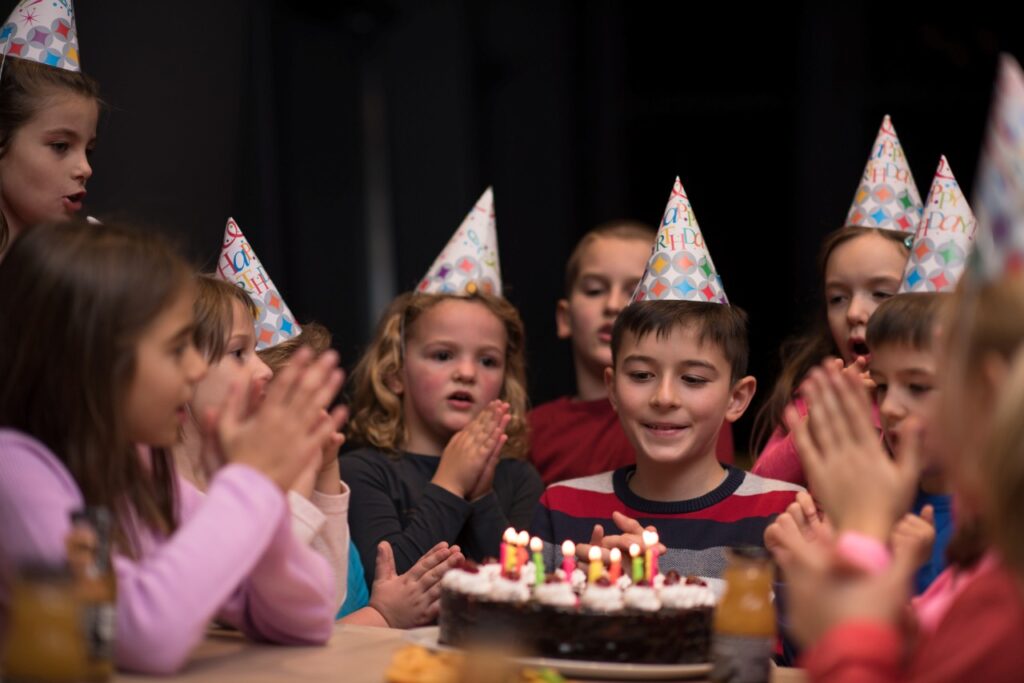 boy celebrating birthday with friends