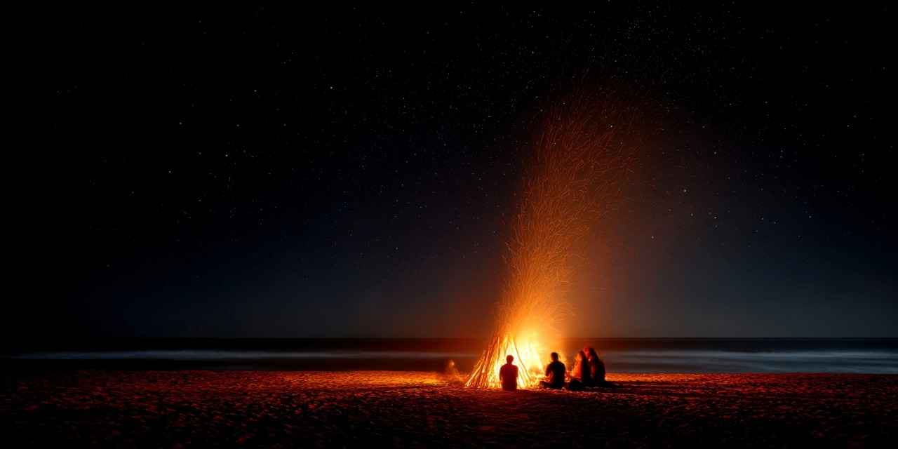 A bonfire on the beach at night