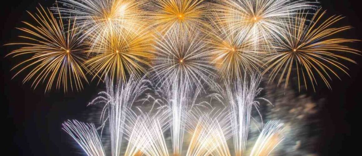 A spectacular finale of fireworks, with layers of colors and light filling the sky