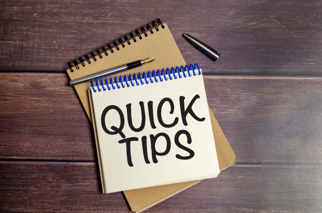 QUICK TIPS words on notebook on wooden background