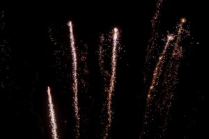 Real fireworks on deep black background sky