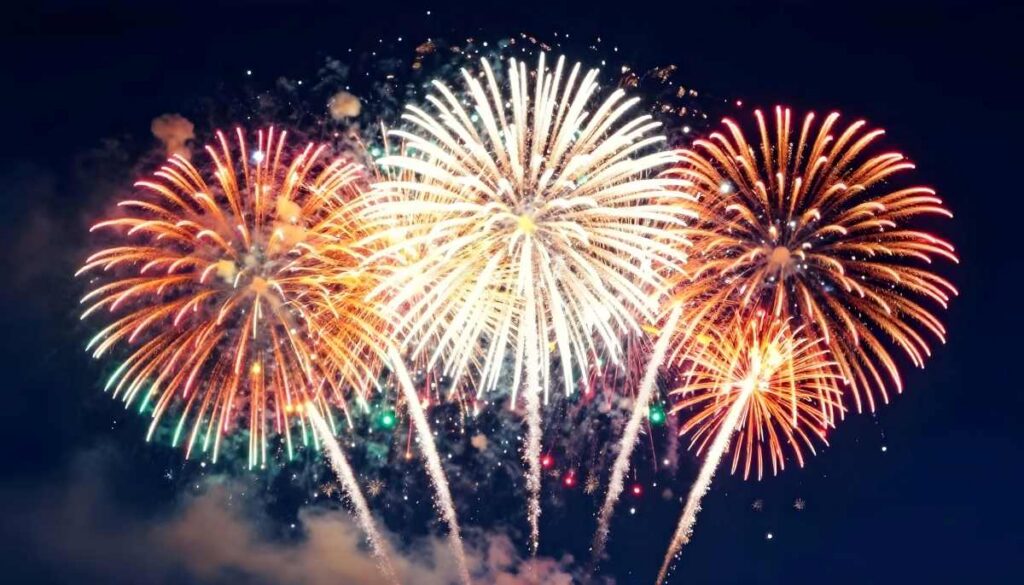 Spectacular fireworks explode in the night sky with vibrant colors and dazzling light displays