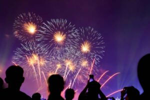 Crowd watching fireworks and celebrating city founded