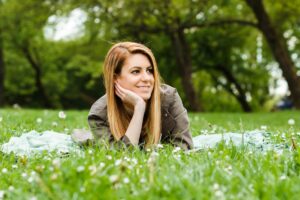 Young woman enjoys spending time in nature